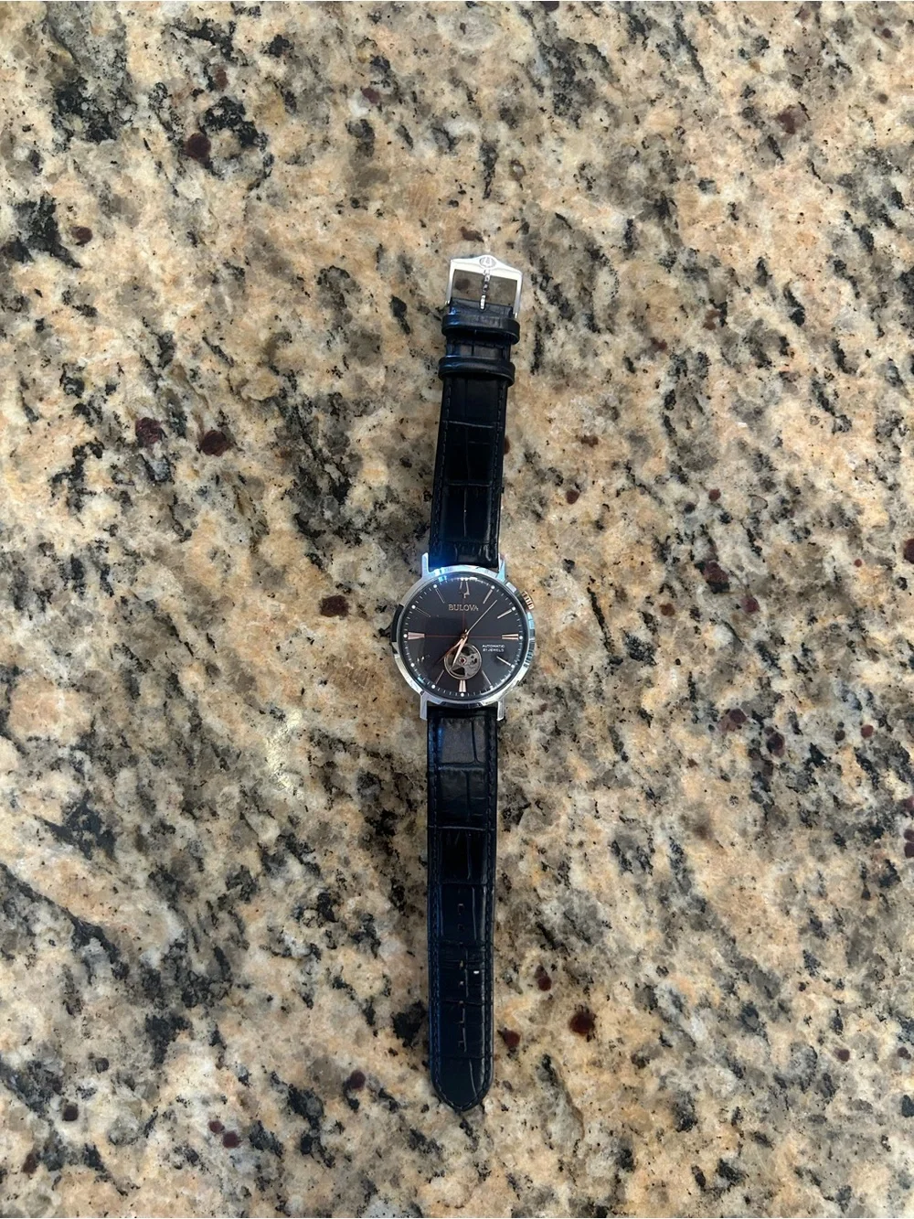 Bulova Black Dial Watch with Rose-Gold Accents and Black Leather Strap.